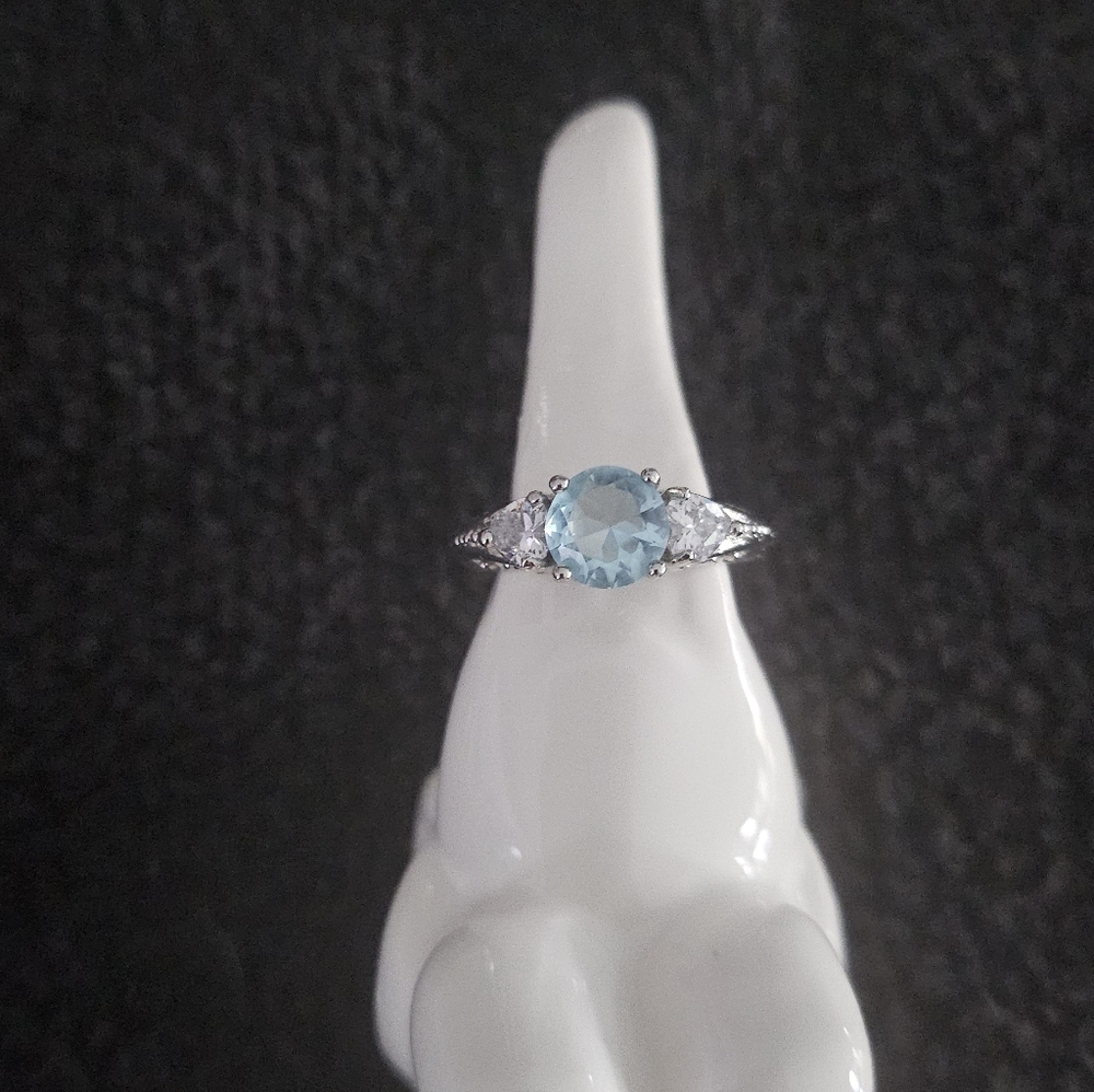 Chic Silver Ring With Blue Gemstone - image 1